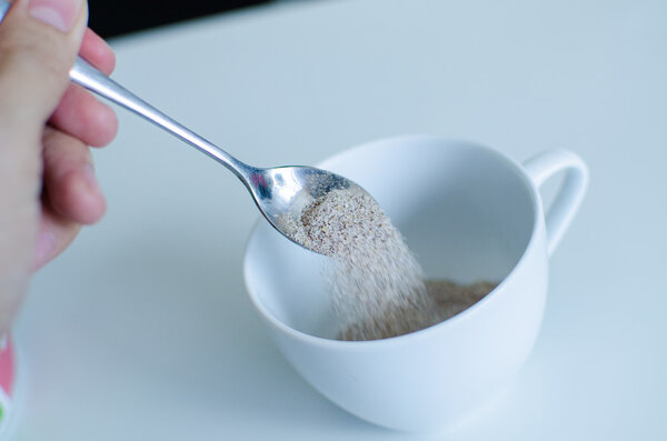 Instant coffee with spoon and coffee cup