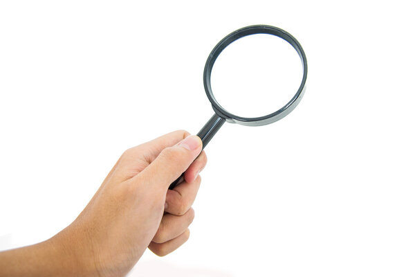 Hand holding black magnifier glass