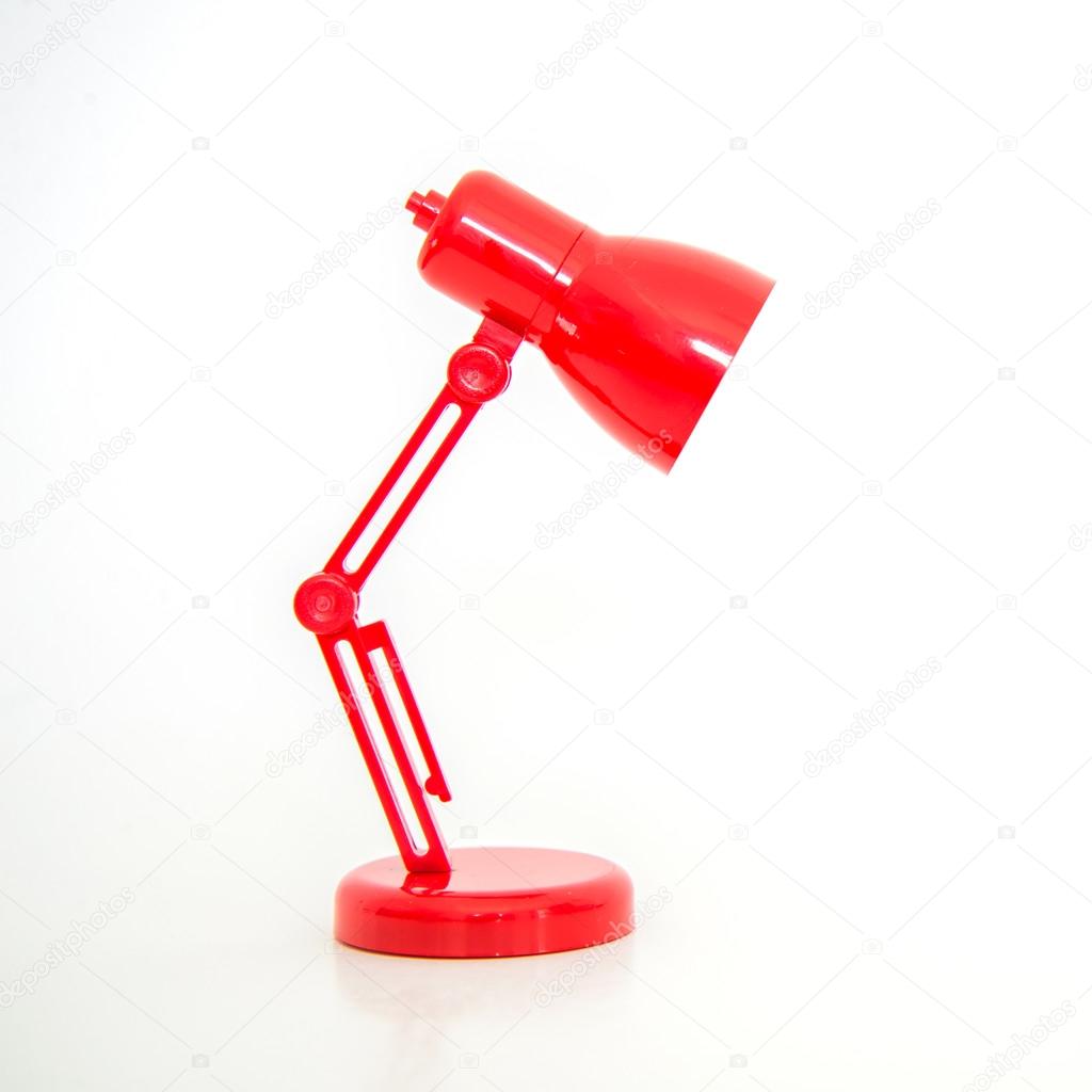 Modern red color desk lamp on white background