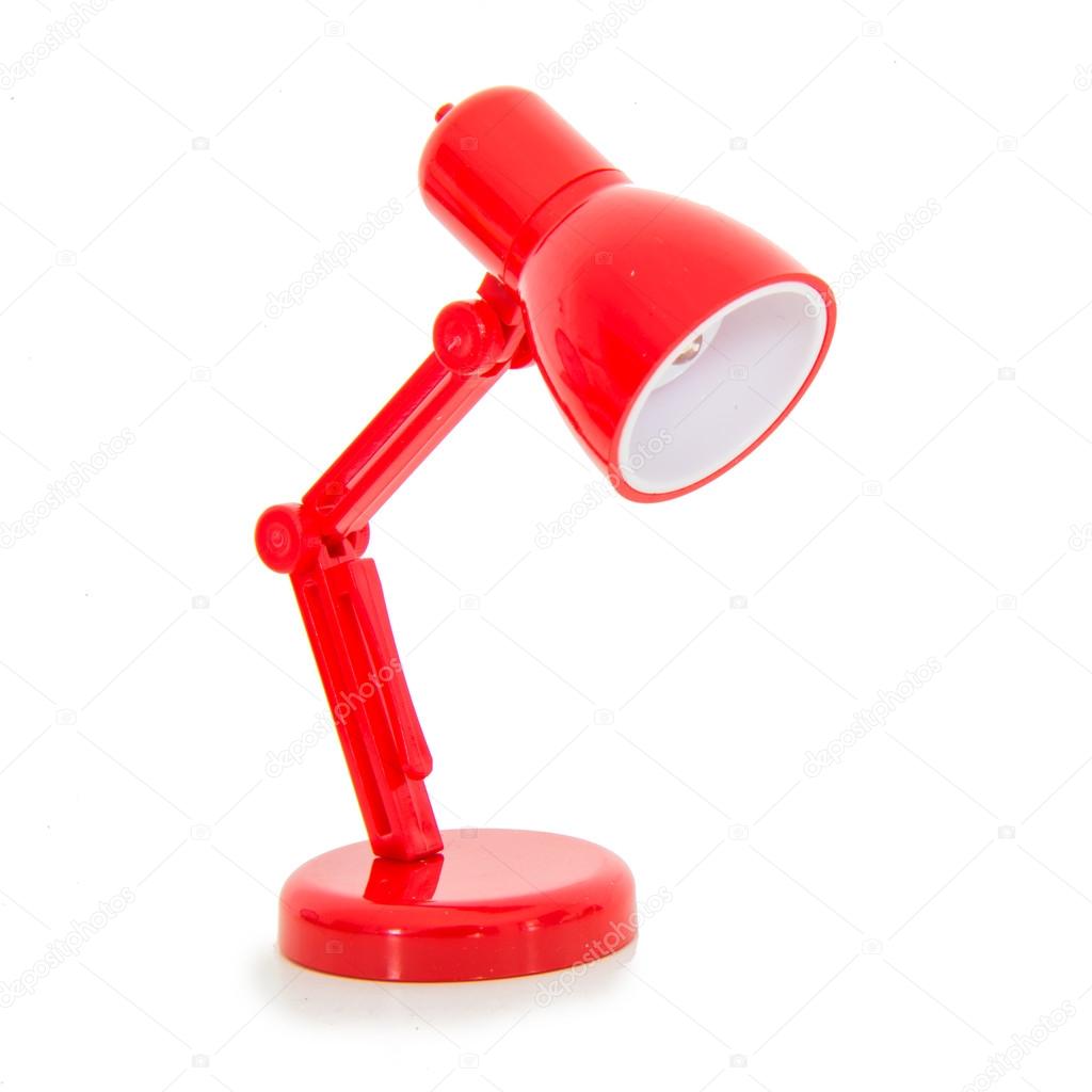 Modern red color desk lamp on white background