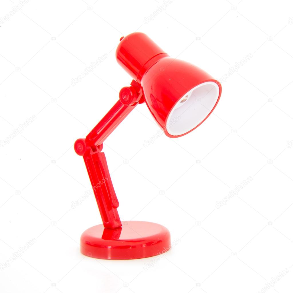 Modern red color desk lamp on white background