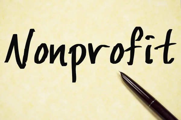 Non-profit słowo pisać na papierze — Zdjęcie stockowe