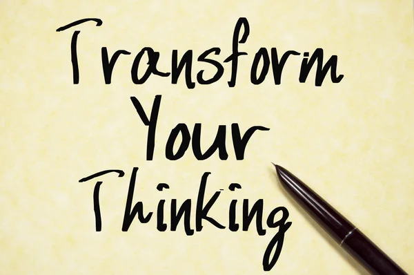 Transform your thinking text write on paper — стоковое фото