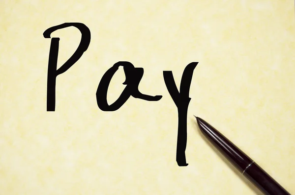 Bezahlen Wort schreiben auf Papier — Stockfoto