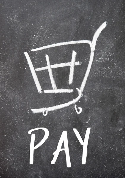 Pay word and shopping cart on blackboard — Stock Photo, Image