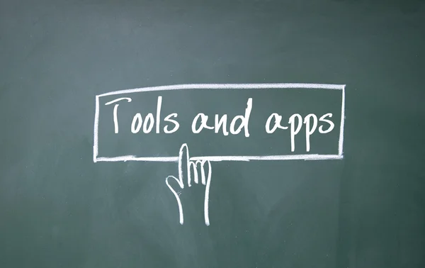 Finger click tools and apps text on blackboard — Stock Photo, Image