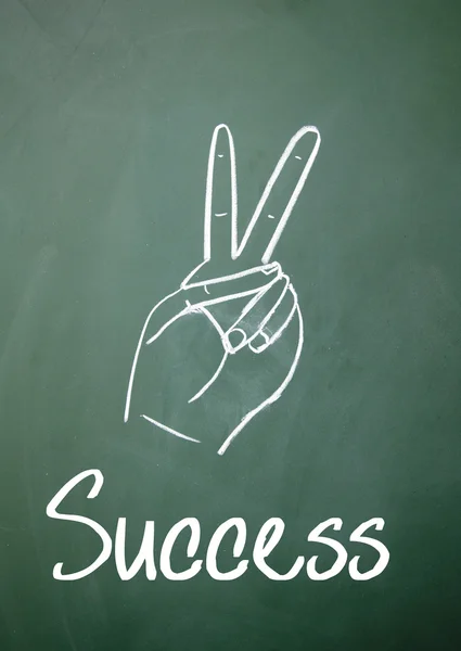 Success gesture on blackboard — Stock Photo, Image