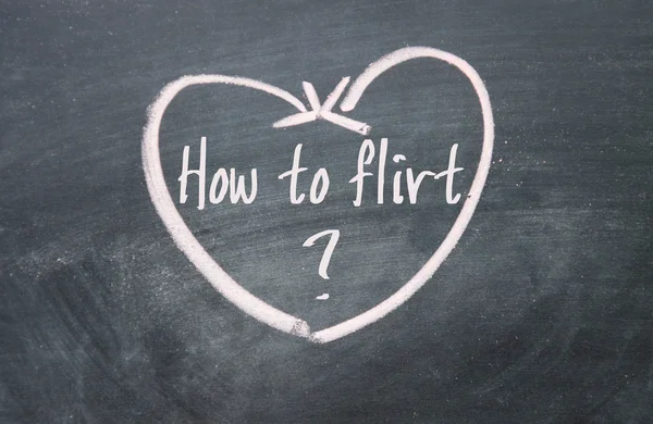 How to flirt text and heart sign on blackboard — Stock Photo, Image