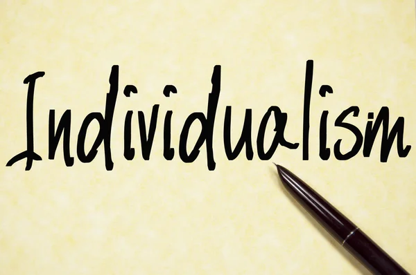 Individualism word write on paper — Stock Photo, Image
