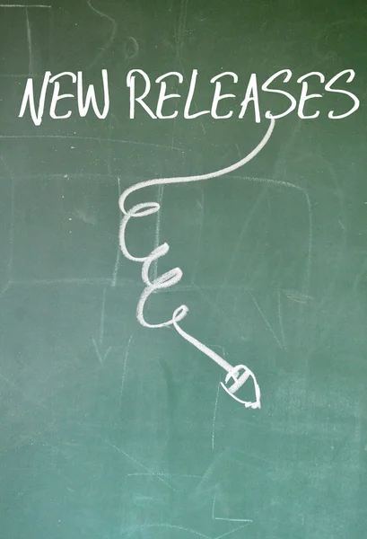 New releases sign write on blackboard — Stock Photo, Image