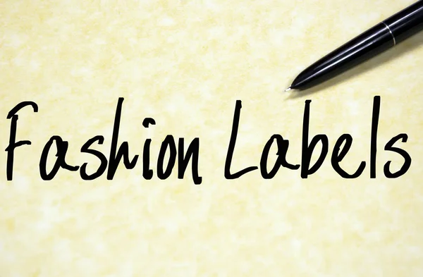 Fashion labels text write on paper — Stock Photo, Image