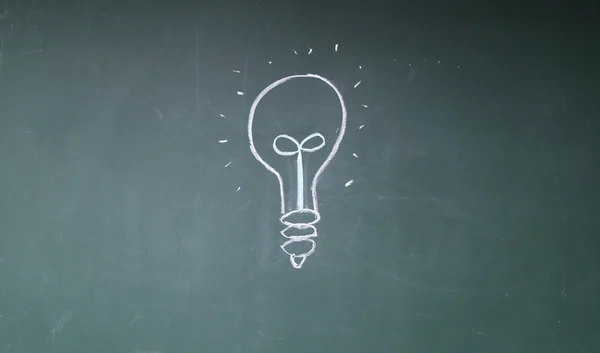 Eco bulb sign on blackboard — Stock Photo, Image