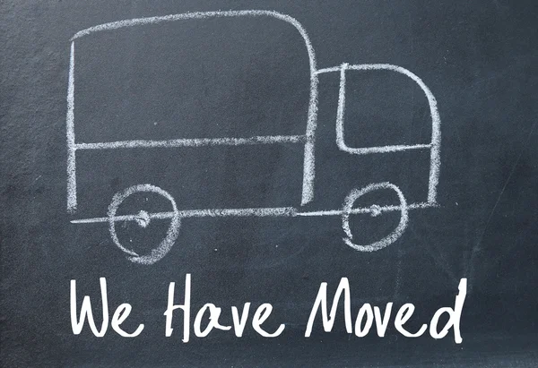 We have moved sign on blackboard — Stock Photo, Image