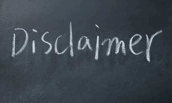 Disclaimer word write on blackboard — стоковое фото