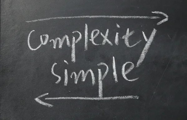 Complexity and simple sign on blackboard — Stock Photo, Image