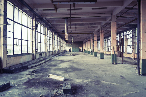 Old abandoned shoe factory at sundown.