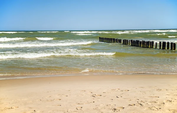 Groins in the Baltic Sea with surf — Stock Photo, Image