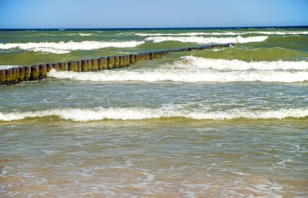 Groins in the Baltic Sea with surf — Stock Photo, Image