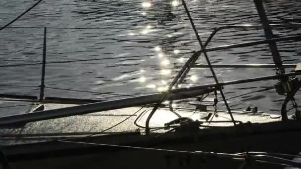 Sailboat in the harbor in backlight — Stock Video