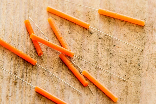 Acupuncture needles on a plank — Stock Photo, Image