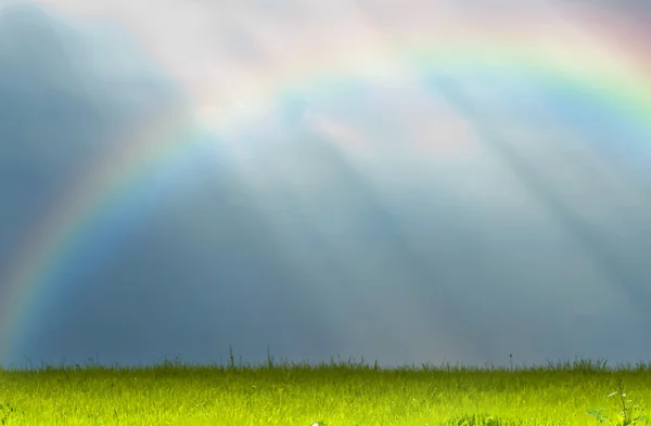 Shafts of sunlight with rainbow — Stock Photo, Image