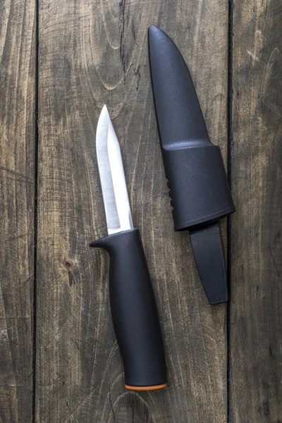Knife with the plastic  handle and a  sheath — Stock Photo, Image
