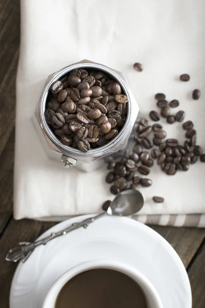 Italian coffee  maker pot filled with coffee beans — Stock Photo, Image