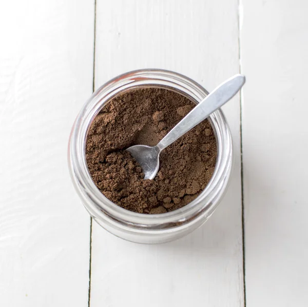 Ground coffee in glass jar — Stock Photo, Image
