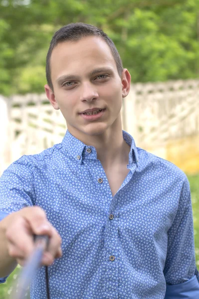 Handsome young man taking selfie — Stock Photo, Image