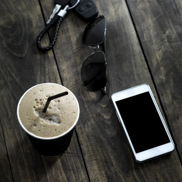 Cup of  coffee drink with sunglasses and mobile phone — Stock Photo, Image