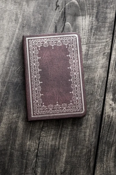 Old notebook on old wooden background — Stock Photo, Image