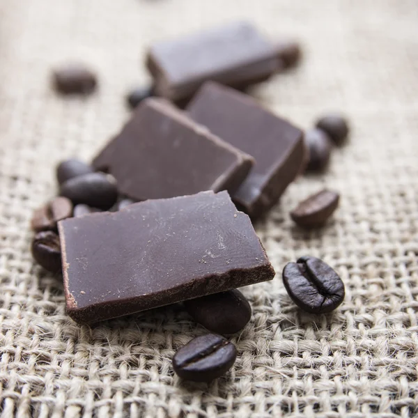 Close up of chocolate and coffee beans — Stock Photo, Image