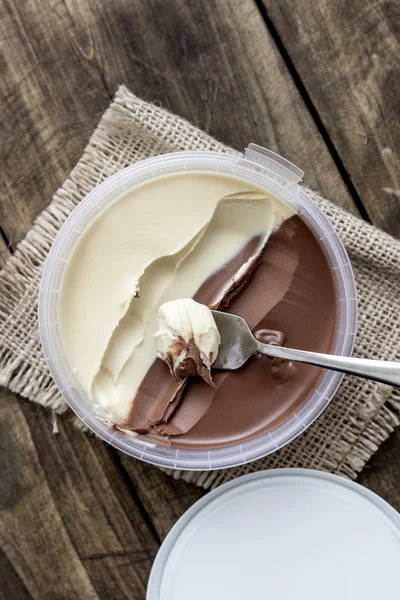 Hazelnut cream on wooden table — Stock Photo, Image