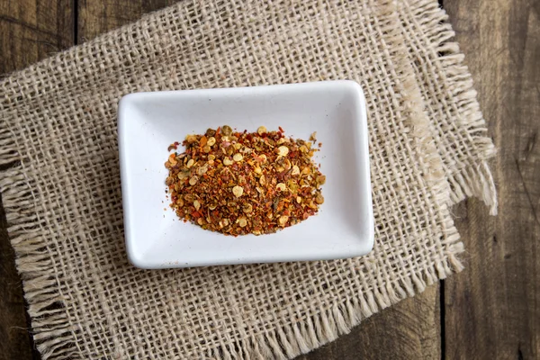 Ground cayenne pepper in bowl — Stock Photo, Image