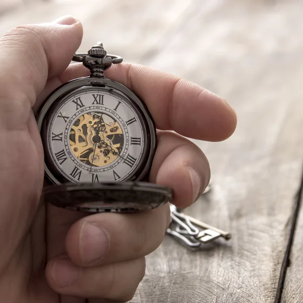 Hands with vintage pocket watch — Stock Photo, Image