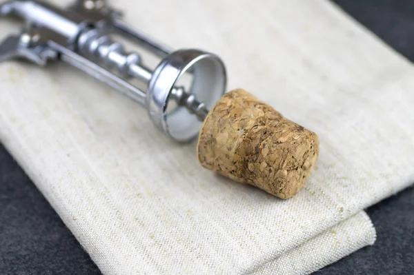 Wine cork and corkscrew on  table — Stock Photo, Image