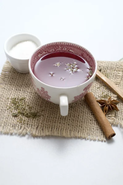 Tea in vintage cup on wooden table — Stock Photo, Image