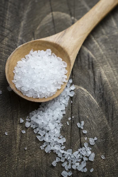 Sea salt in wooden  spoon — Stock Photo, Image