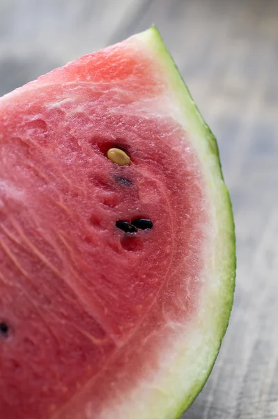 Slice of watermelon on wooden table — Stock Photo, Image