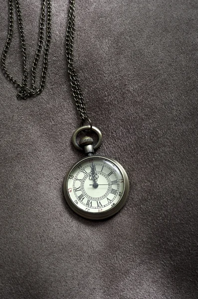 Vintage antique pocket watch on fabric — Stock Photo, Image