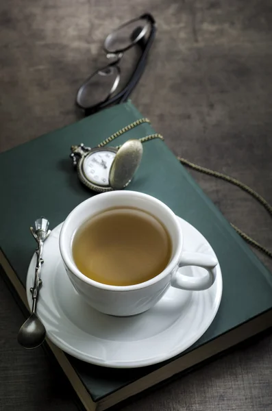 Cup of tea with book on table — Stock Photo, Image