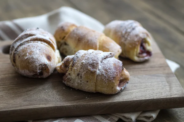 Baked croissants stuffed with jam — Stock Photo, Image