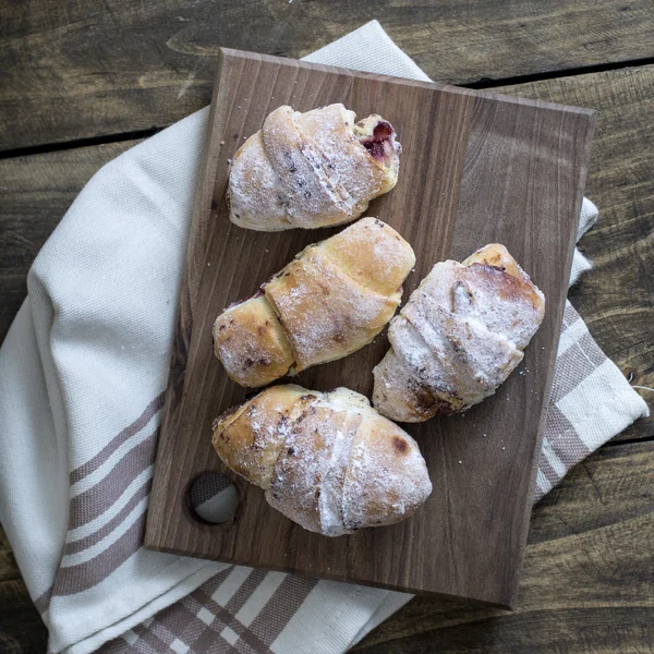 Baked croissants stuffed with jam — Stock Photo, Image