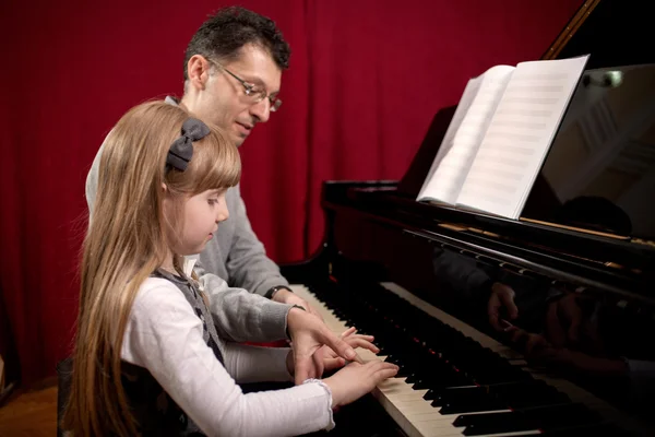 Piano player and his little girl student during lesson — Stock Photo, Image