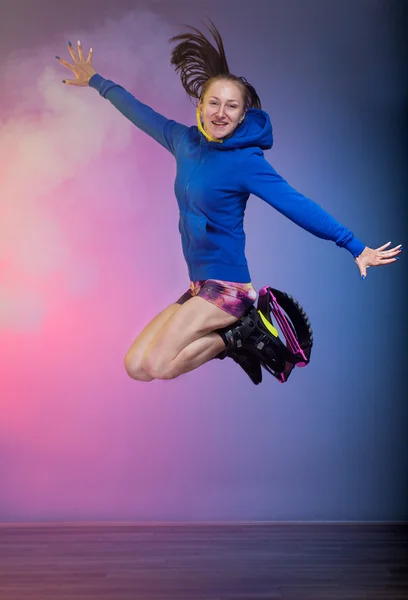 Woman exercising and jumping with kangoo jumps shoes — Stock Photo, Image