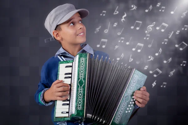 Little musician playing the accordion — Stock Photo, Image