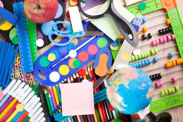 Full background of a colorful assortment of school supplies — Stock Photo, Image