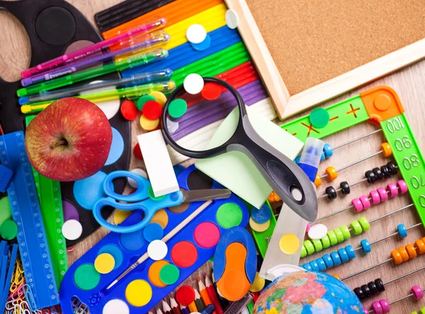 Full background of a colorful assortment of school supplies — Stock Photo, Image