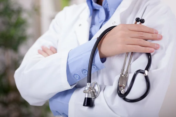 Portrait an unknown young female doctor holding a stethoscope — Stock Photo, Image