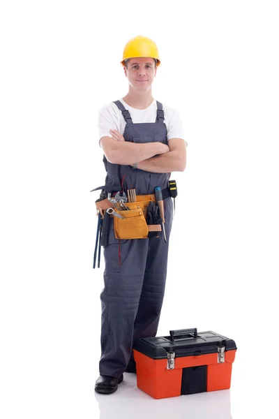 Joven trabajador con equipo caja de herramientas aislada en blanco — Foto de Stock